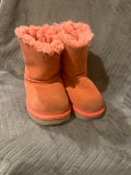 Girls pink suede UGG boots