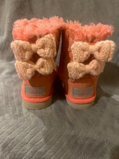 Girls pink suede UGG boots