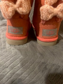 Girls pink suede UGG boots